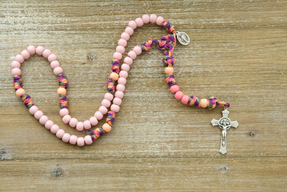 Little Lady's Miracle Rosary - Pink Camo Kid's 5 Decade Paracord Rosary featuring durable, unbreakable paracord design, adorable light pink and peachy orange beads, and a smaller Miraculous Medal for children to easily pray on-the-go while connecting with their Catholic heritage.