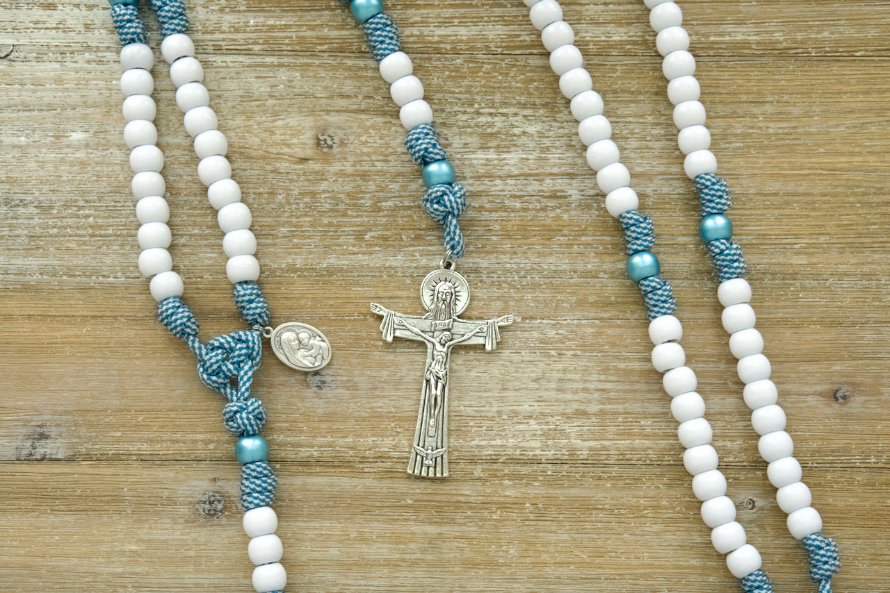 Beautiful blue and white teal striped 5 decade paracord rosary with Mater Boni Consilii (Our Lady of Good Counsel) and Holy Trinity medals, and a 3-inch Holy Trinity crucifix. Premium Catholic gift for deepening faith and spiritual growth.
