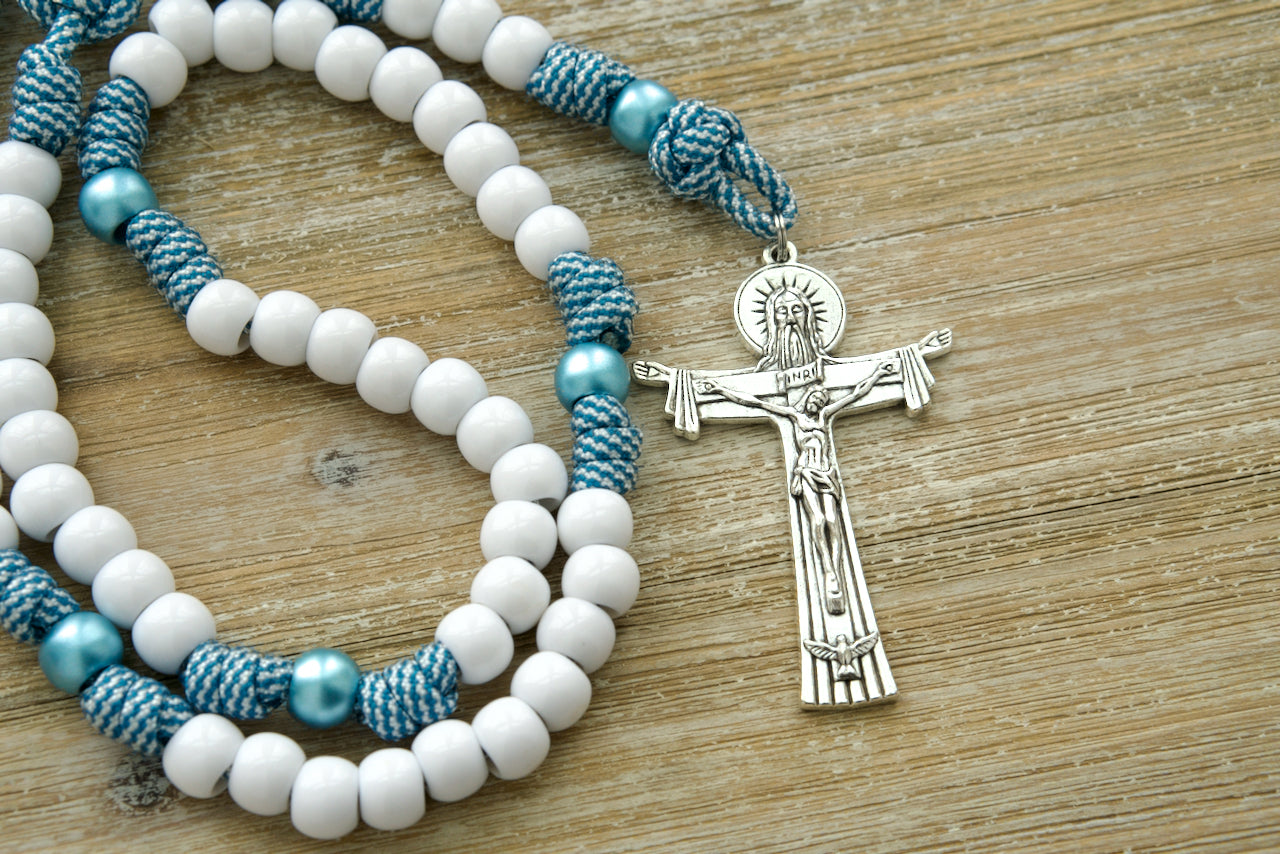 Mater Boni Consilii (Our Lady of Good Counsel) - Teal Blue and White - 5 Decade Paracord Rosary. A stunning and durable Catholic gift featuring a large Holy Trinity crucifix, Mater Boni Consilii/Holy Trinity devotional medal, and premium paracord construction for unbreakable strength in prayer.
