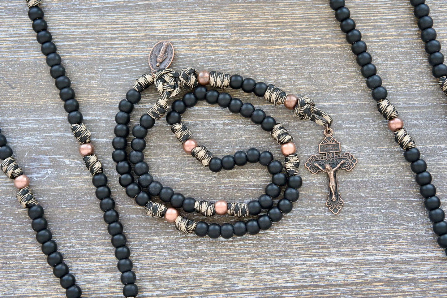 Mini Duty Hail Mary kids rosary in camo paracord with 10mm black beads, antique copper Our Father beads, and a copper crucifix.