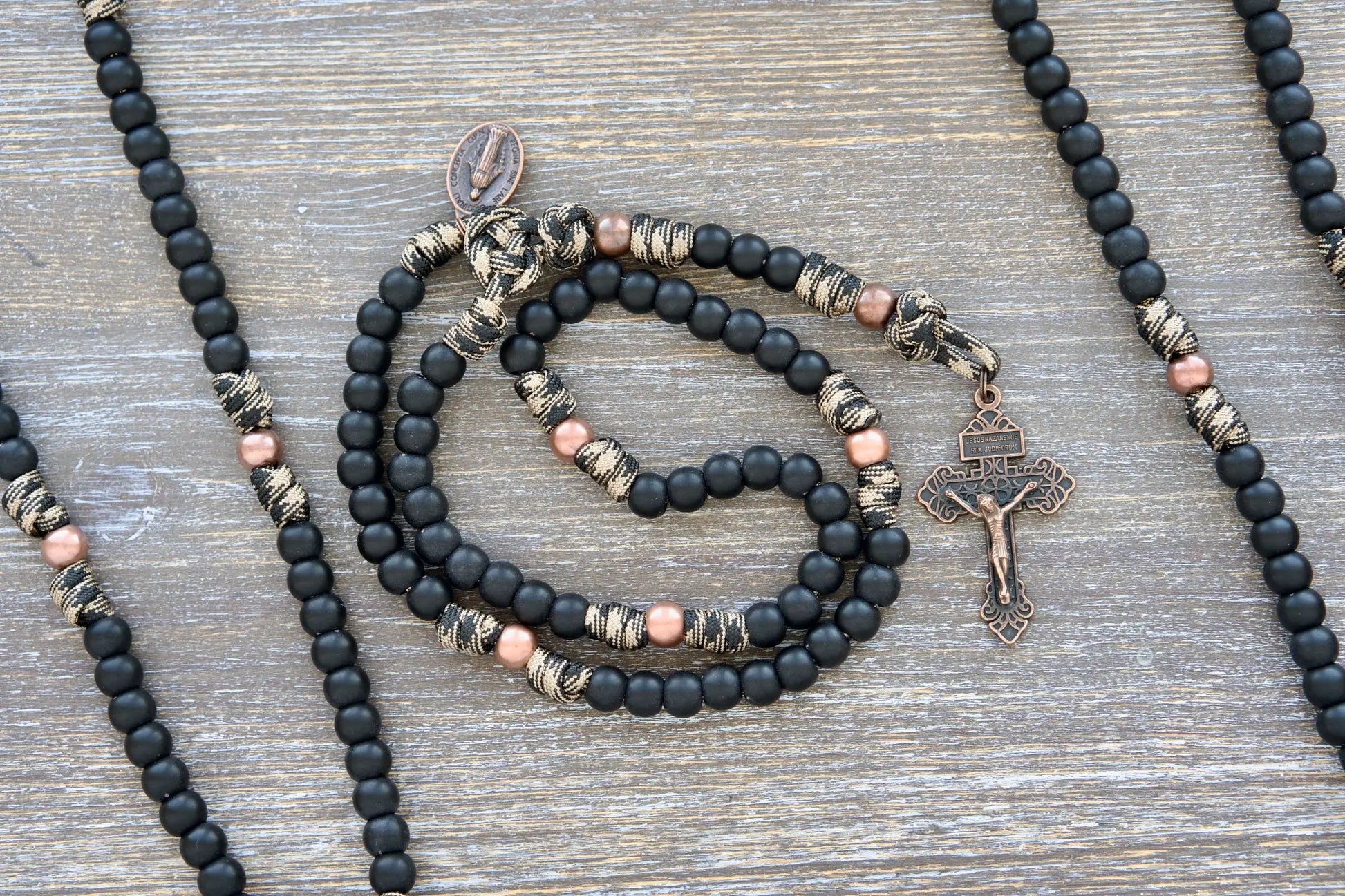 Mini Duty Hail Mary kids rosary in camo paracord with 10mm black beads, antique copper Our Father beads, and a copper crucifix.