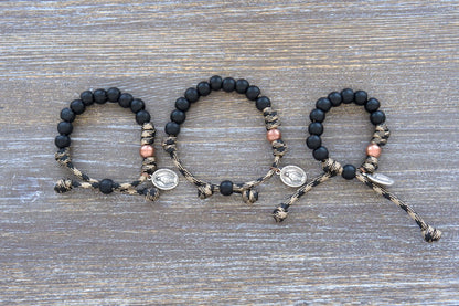Rugged 10mm matte black acrylic beads, a single antique copper Our Father bead, and a small Miraculous Medal on this Mini Duty Hail Mary Kid's Rosary Bracelet.