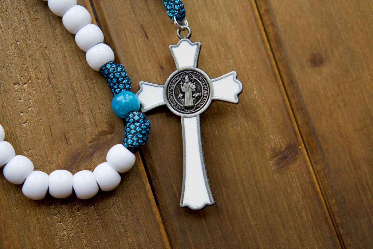 Our Lady of Perpetual Help - Turquoise - 5 Decade Paracord Rosary: A durable, premium, unbreakable paracord rosary with a one-of-a-kind Our Lady of Perpetual Help design. Featuring white Hail Mary beads, matching turquoise Our Father beads, and a large 3" white enamel St. Benedict Crucifix for maximum impact in prayer.