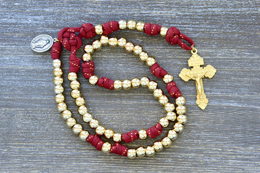 Scarlet Crown - Kid's 5 Decade Paracord Rosary: Gold-accented red paracord rosary with gold beads, Hail Mary and Our Father beads, Miraculous Medal, Pardon Crucifix, durable for spiritual journeys, perfect for kids.