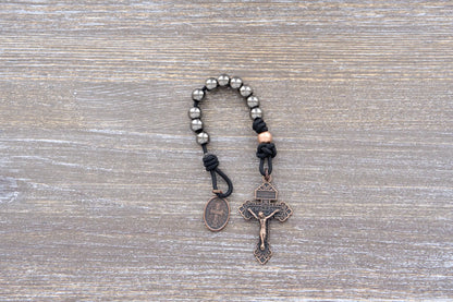 Premium metal paracord rosary with copper crucifix and St. Benedict medal, designed for spiritual wear and everyday use