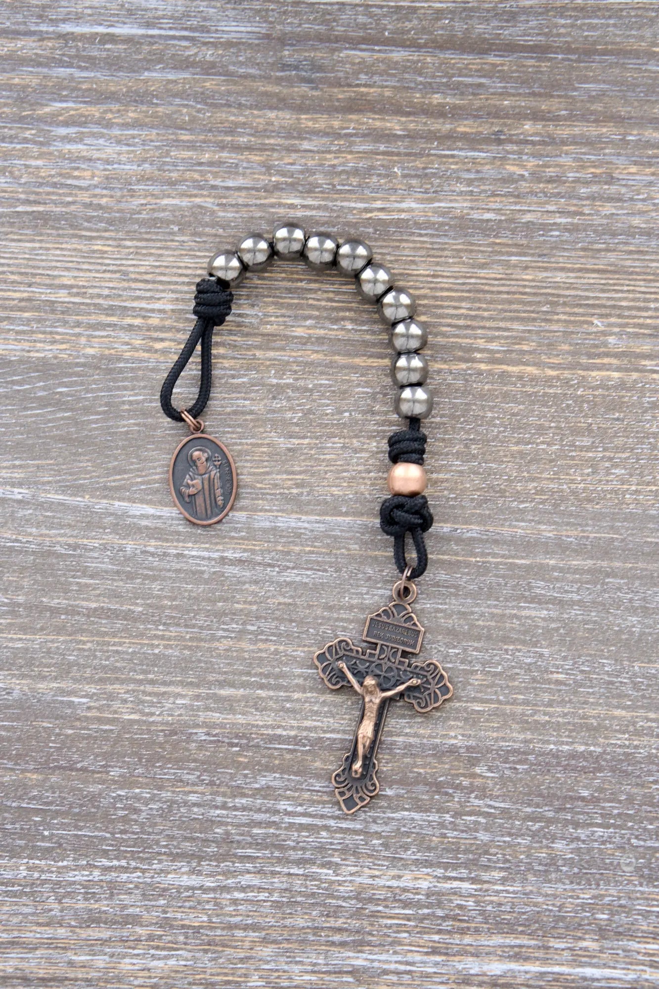 Premium metal paracord rosary with alloy beads, copper crucifix, and St. Benedict medal – durable, spiritual, and crafted for the disciple's journey