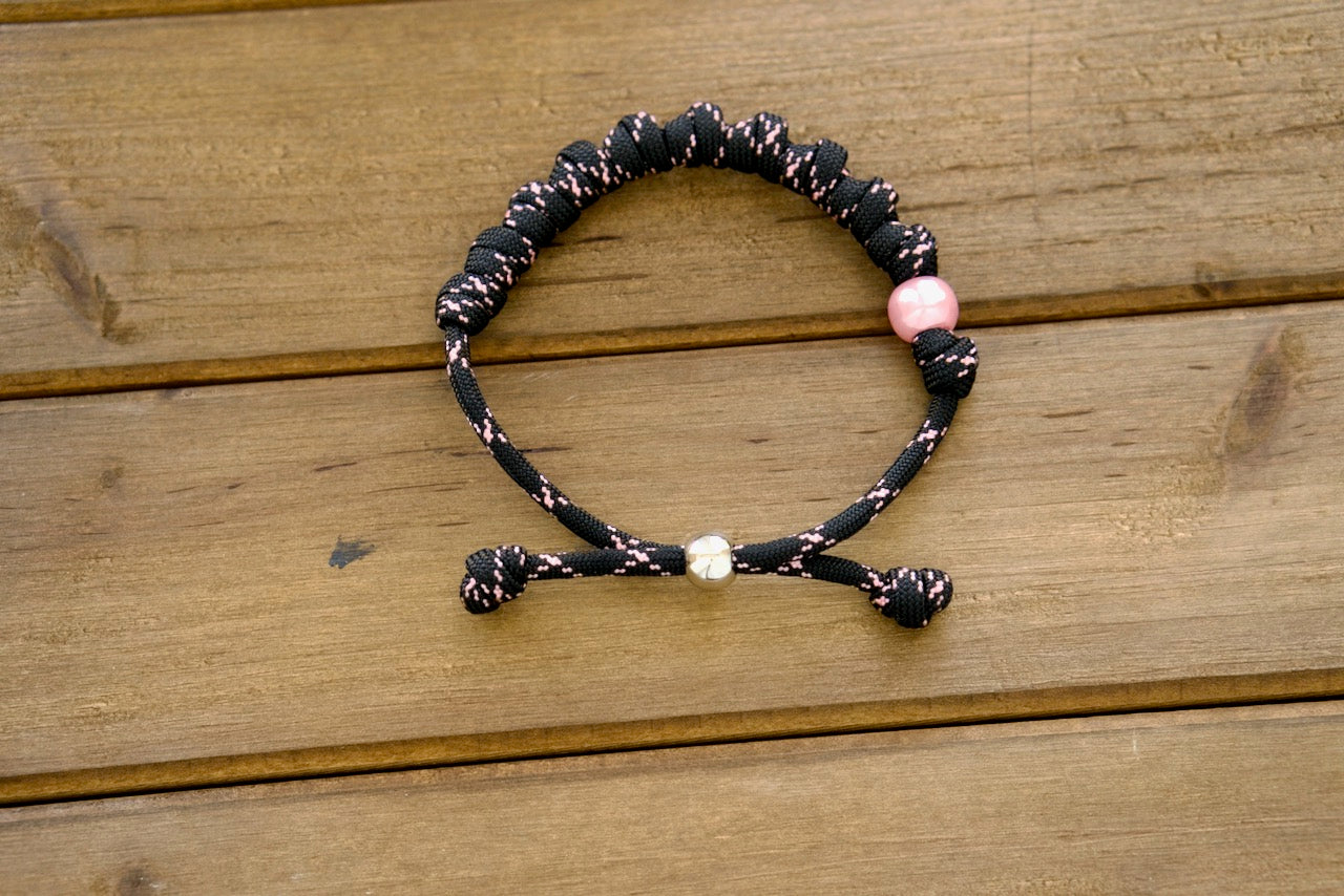 Pink and Black Rosary Bracelet: Durable, Stylish Unbreakable Paracord Catholic Gift for Daily Prayer and Faith Expression.