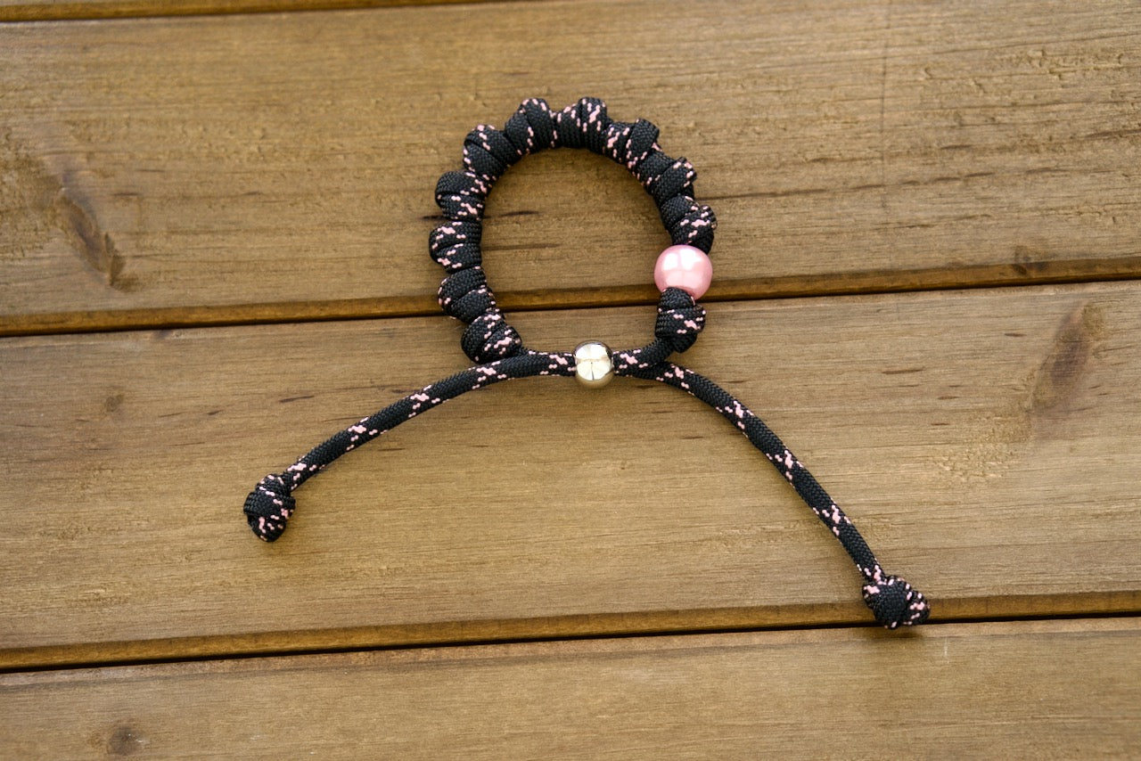 Pink and Black Rosary Bracelet - Handcrafted, Durable Catholic Accessory Made from Premium Quality Paracord 550 Rope with Stylish Pink and Black Accents for Daily Prayer and Inspiration.