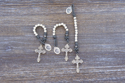 Premium metal paracord rosary featuring gray rope, silver beads, St. Joseph medal, and pardon crucifix.