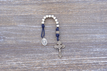 Reclaim Christendom rosary in premium metal paracord with gunmetal crucifix, available in navy, maroon, or iron gray.