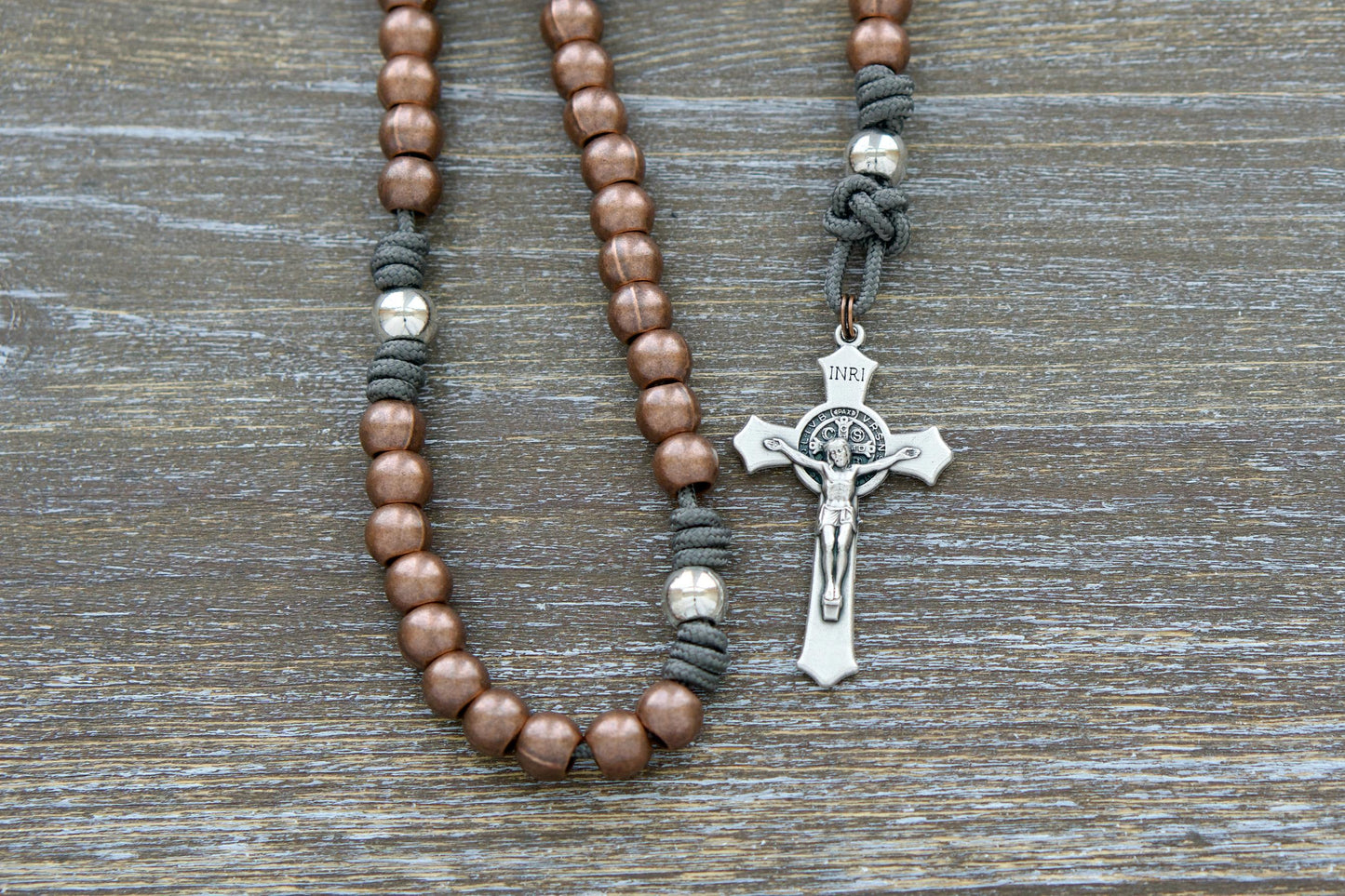 St. Michael's Sword - Premium Metal Paracord Rosary with grey paracord, copper Hail Mary beads, silver Our Father beads, silver St. Michael centerpiece medal, and silver 2-inch St. Benedict crucifix