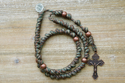 The Serpent Slayer - Camo and Copper - Knotted Rope Rosary: A durable, premium paracord rosary featuring a bold camo and copper design. Perfect for spiritual warriors of all ages to carry into battle against evil. Handmade with love by our Catholic family for unbreakable strength in faith.