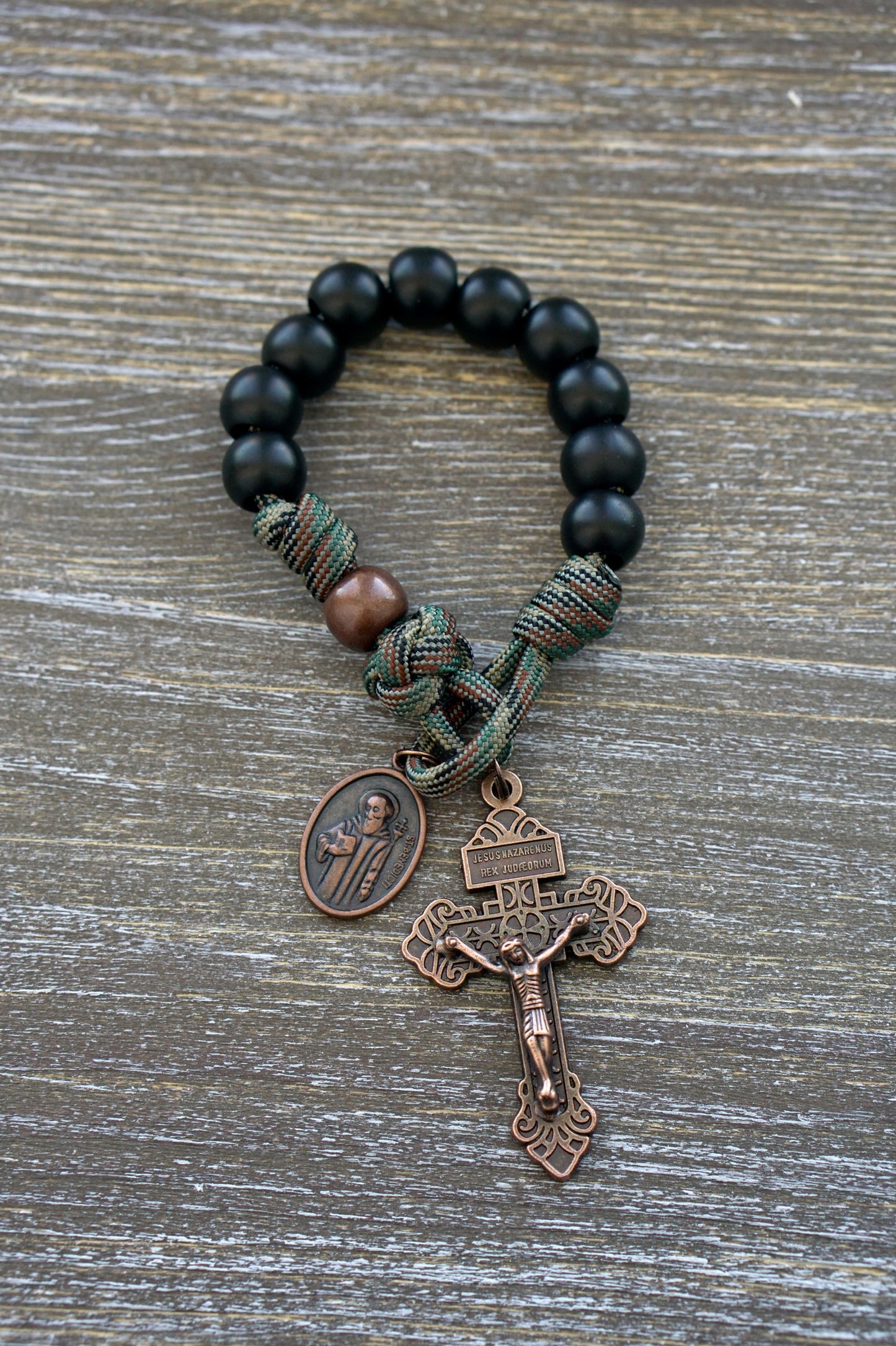 The Serpent Slayer - Pocket Paracord Rosary: A Masculine and Powerful Spiritual Weapon Against Evil, Featuring Matte Black Hail Mary Beads, Antique Copper Our Father Bead, Antique Copper Pardon Crucifix with St. Benedict Medal.