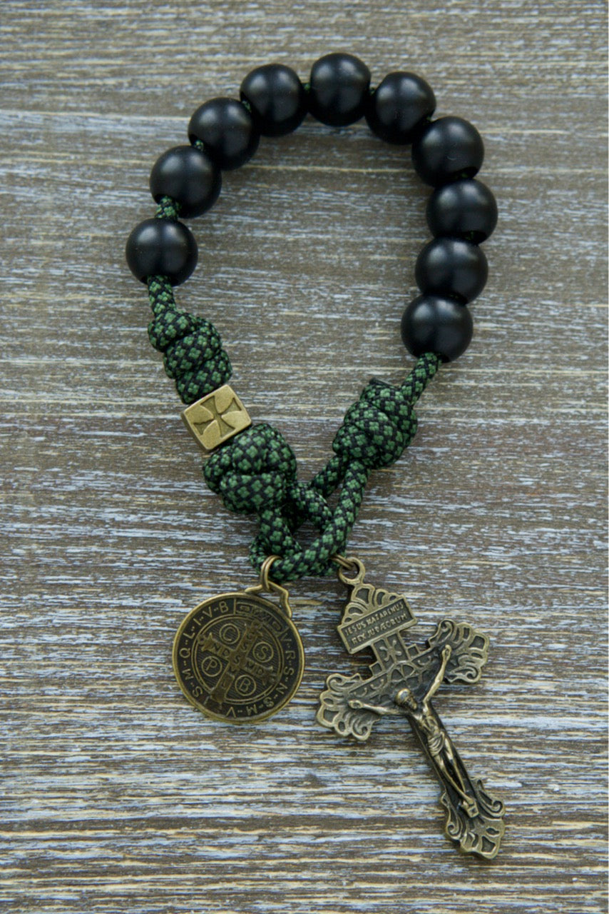 Sanctus Servo's Shield of Faith - Green, Black and Olive 1 Decade Paracord Rosary: Premium durable green camo paracord rosary with black Hail Mary beads, unique bronze Crusader cross Our Father beads, a bronze 2" Pardon Crucifix and a bronze St. Benedict medal for spiritual strength and portability.