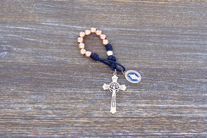 Splendor of the Stars paracord rosary with rose gold metal beads, crucifix, and blue enamel miraculous medal