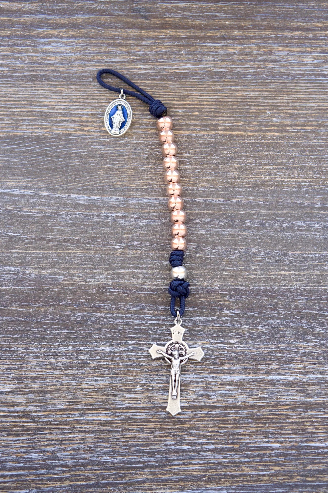 Splendor of the Stars pocket paracord rosary with rose gold metal beads, crucifix, and blue enamel miraculous medal