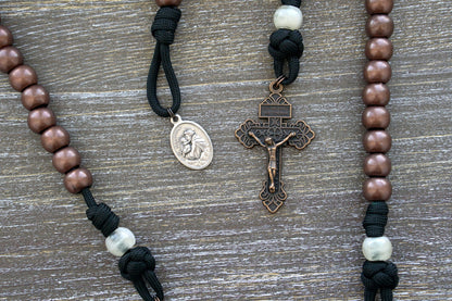 St. Anthony Heretic Hammer Pocket Paracord Rosary - Black and copper paracord rosary with pearl beads, St. Anthony devotional medal, and a 2 inch pardon crucifix for daily prayer and heresy-fighting.