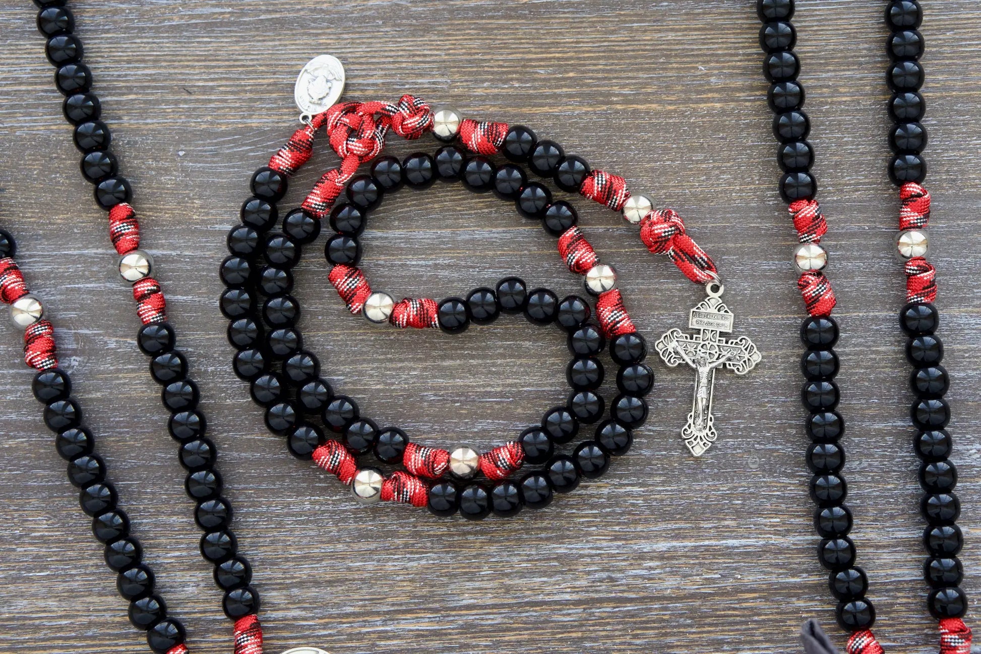 Durable 5-decade firefighter rosary, featuring 12mm black beads and silver accents for strength & prayer.