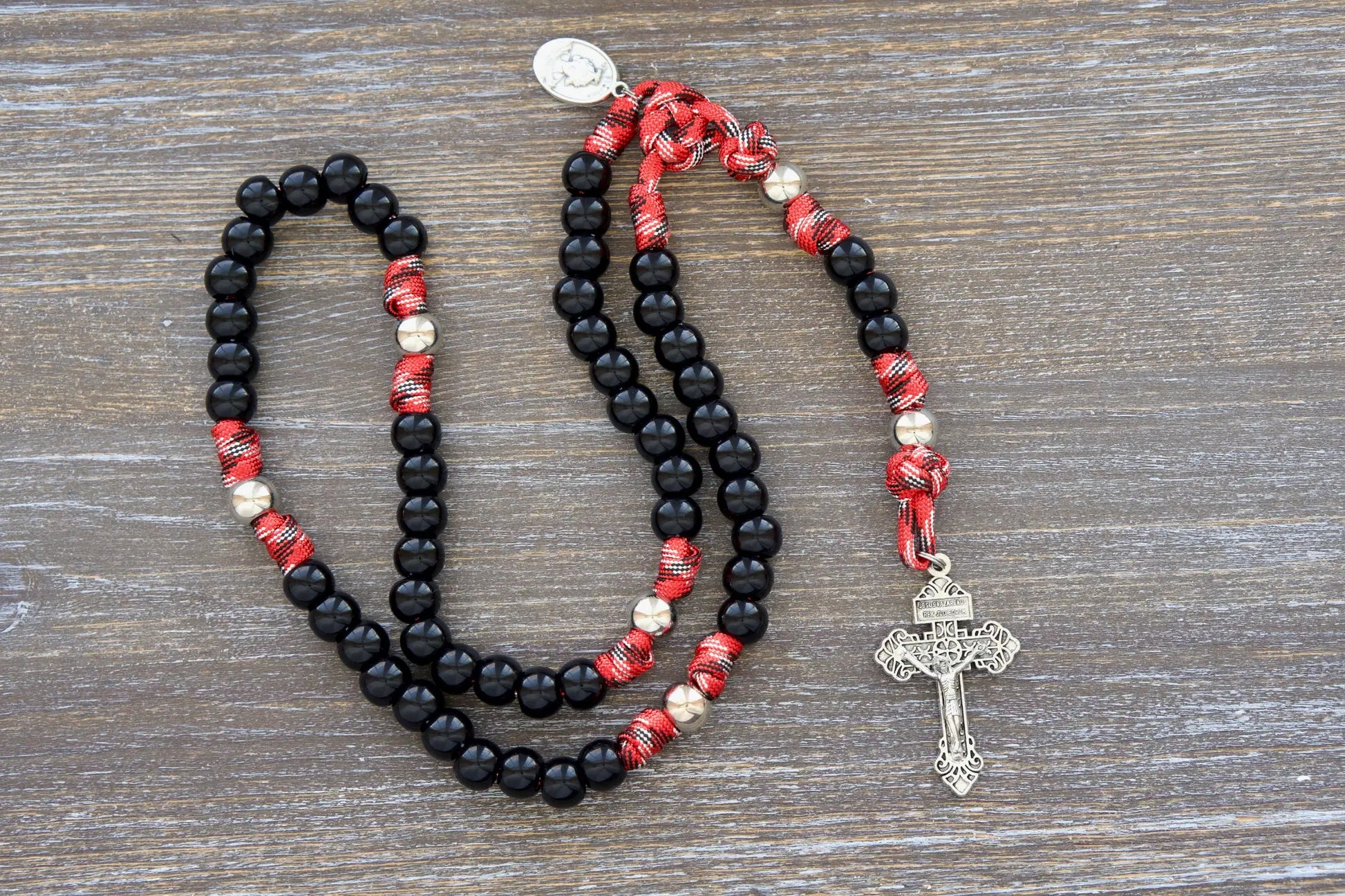 12mm black bead rosary with silver accents, a symbolic tribute to firefighters and first responders' service.
