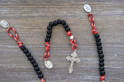 Pocket-sized paracord rosary featuring St. Florian medal, patron saint of firefighters and EMS professionals.