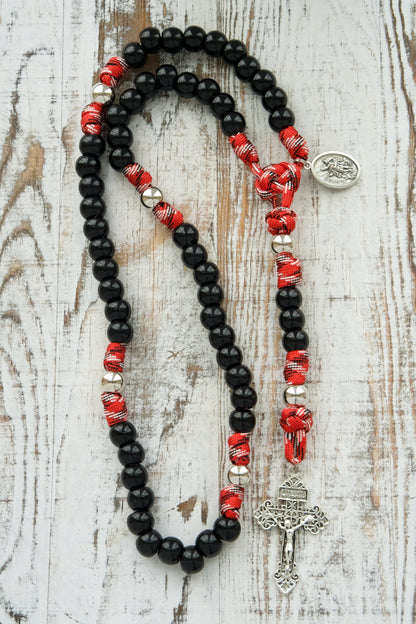Unleash Saint Florian's Strength in your life with our premium unbreakable paracord rosary designed for firefighters, EMS professionals, and first responders. 5 decade rosary with durable black beads, silver pardon crucifix, and St. Florian medal