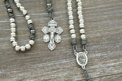 Unbreakable Paracord Rosary: Protector of Holy Church - St. Joseph, featuring durable grey paracord, silver alloy Hail Mary beads, gunmetal Our Father beads, St. Joseph centerpiece devotional medal and 2" Pardon Crucifix for traditional Catholics.