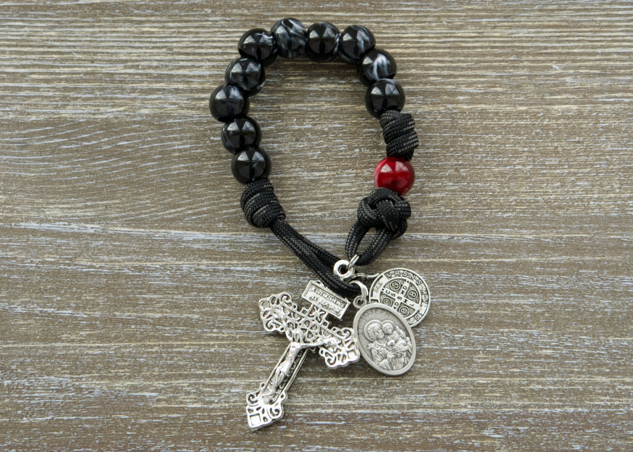 Embrace spiritual strength with our unbreakable paracord "Terror of Demons" 1 Decade St. Joseph Paracord Rosary, expertly crafted and equipped with powerful protectors St. Joseph & St. Benedict. 