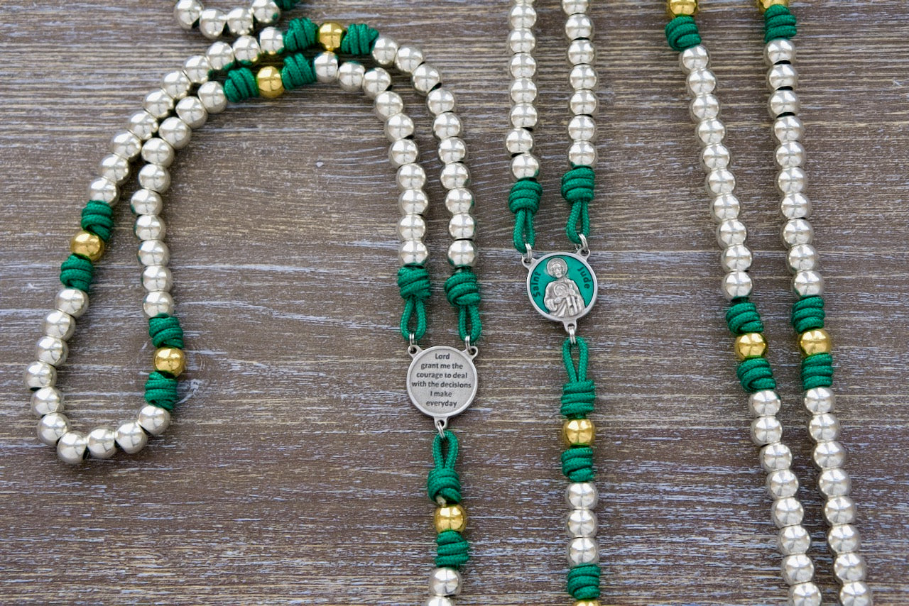St. Jude the Miracle Worker Premium Metal Paracord Rosary, featuring durable Kelly green paracord, elegant silver and gold beads, and a stunning St. Jude enamel medal for unbreakable Catholic devotion.