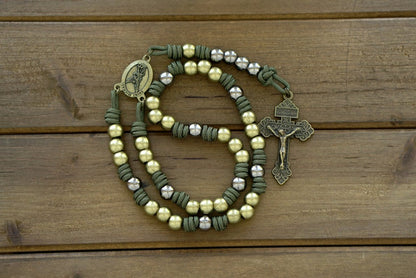 St. Michael Chaplet - Olive and Gunmetal: A handmade paracord chaplet featuring Army Green cord, olive Pardon Crucifix and Hail Mary beads, gunmetal Our Father beads, and an olive St. Michael centerpiece. Durable and reverent.