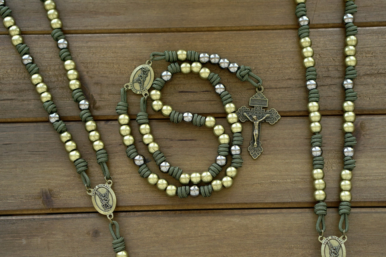 St. Michael Chaplet - Olive and Gunmetal: Handmade paracord chaplet with olive Crucifix, Hail Mary beads, and a St. Michael centerpiece in gunmetal and Army Green paracord. Designed for strength and devotion.