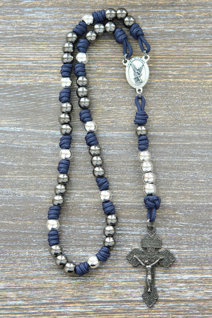 Navy blue St. Michael paracord chaplet with 10mm metal alloy beads and a silver St. Michael medal centerpiece.  

