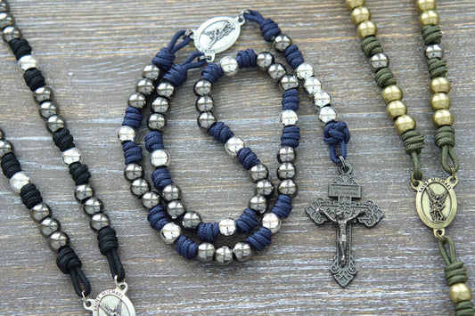 Black, blue, or green premium St. Michael paracord chaplet featuring 10mm metal alloy beads, Pardon Crucifix, and a St. Michael medal centerpiece.  