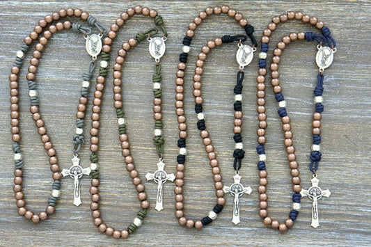 Premium paracord rosary with durable 10mm alloy metal Hail Mary (copper) and Our Father (silver) beads, featuring a radiant St. Michael centerpiece.