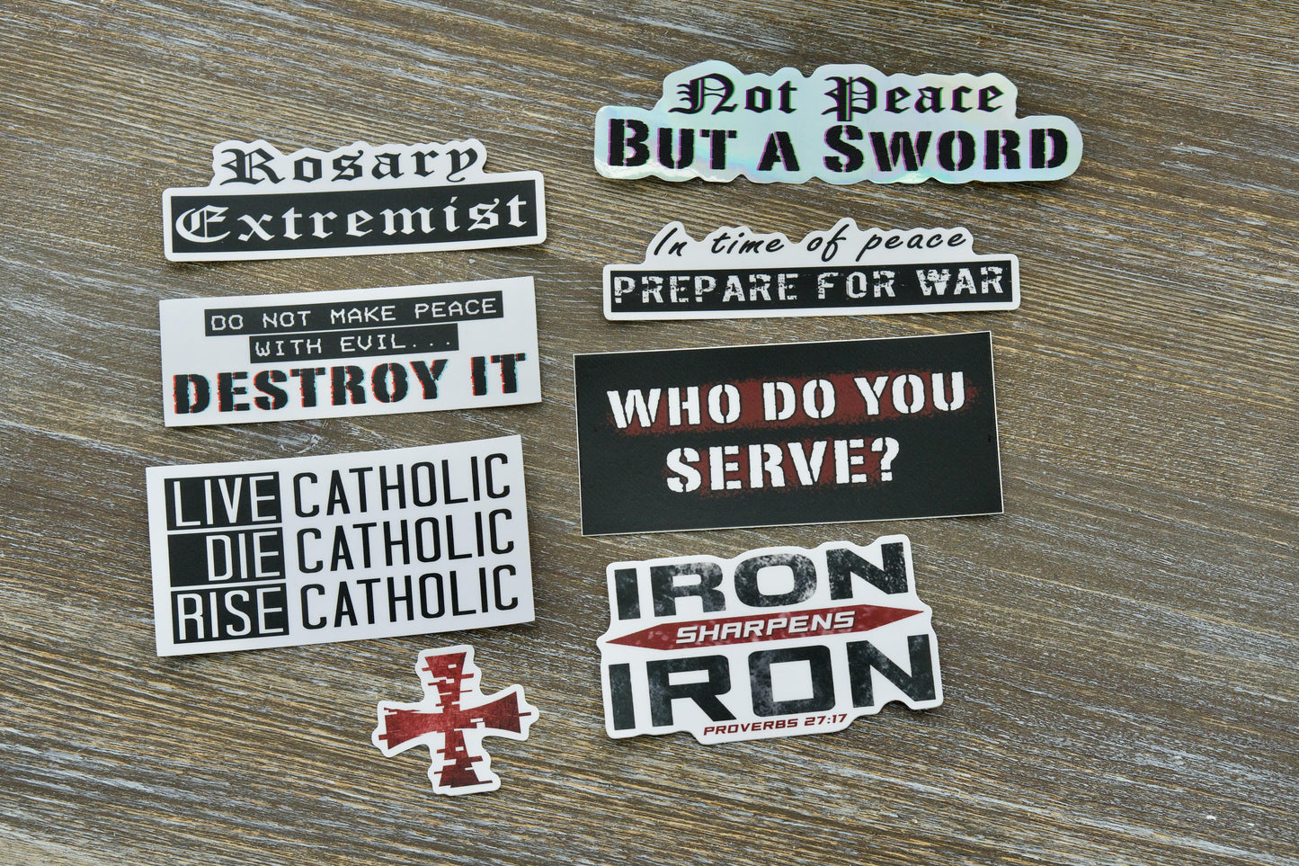 Pack of 8 durable vinyl 'Warfare' themed stickers featuring Catholic imagery and Scripture (Ephesians 6:13) for laptops, water bottles, notebooks, and more. Perfect for evangelization and sharing your faith.