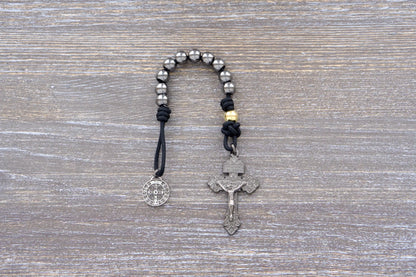 Stronghold of Grace pocket paracord rosary with 10mm gunmetal beads, gold Our Father beads, and 2-inch Pardon crucifix