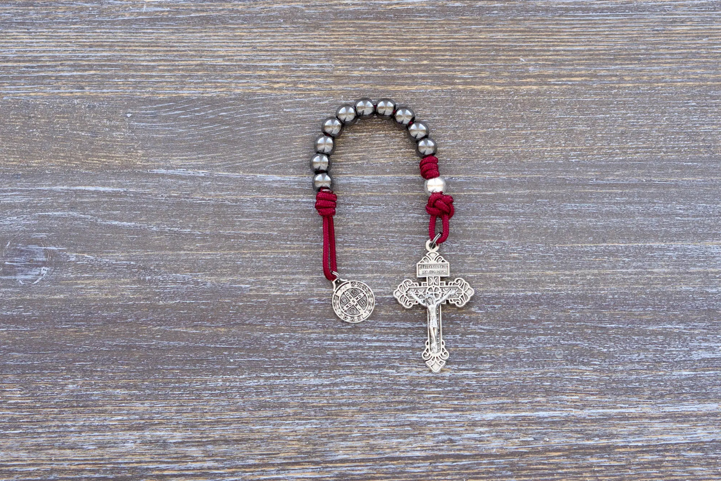 Sword of the Faithful paracord rosary with gunmetal and silver beads, St. Benedict medal, and 2-inch Pardon crucifix.