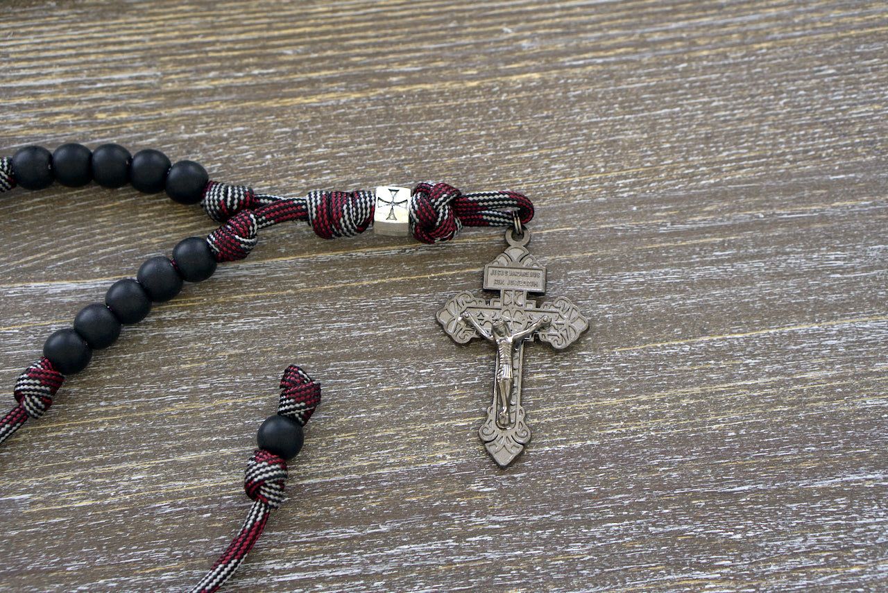 The Crusader Rearview Mirror Rosary - A stylish, handmade paracord rosary with metal and acrylic beads, designed to hang from your car's rearview mirror for easy access during prayer.