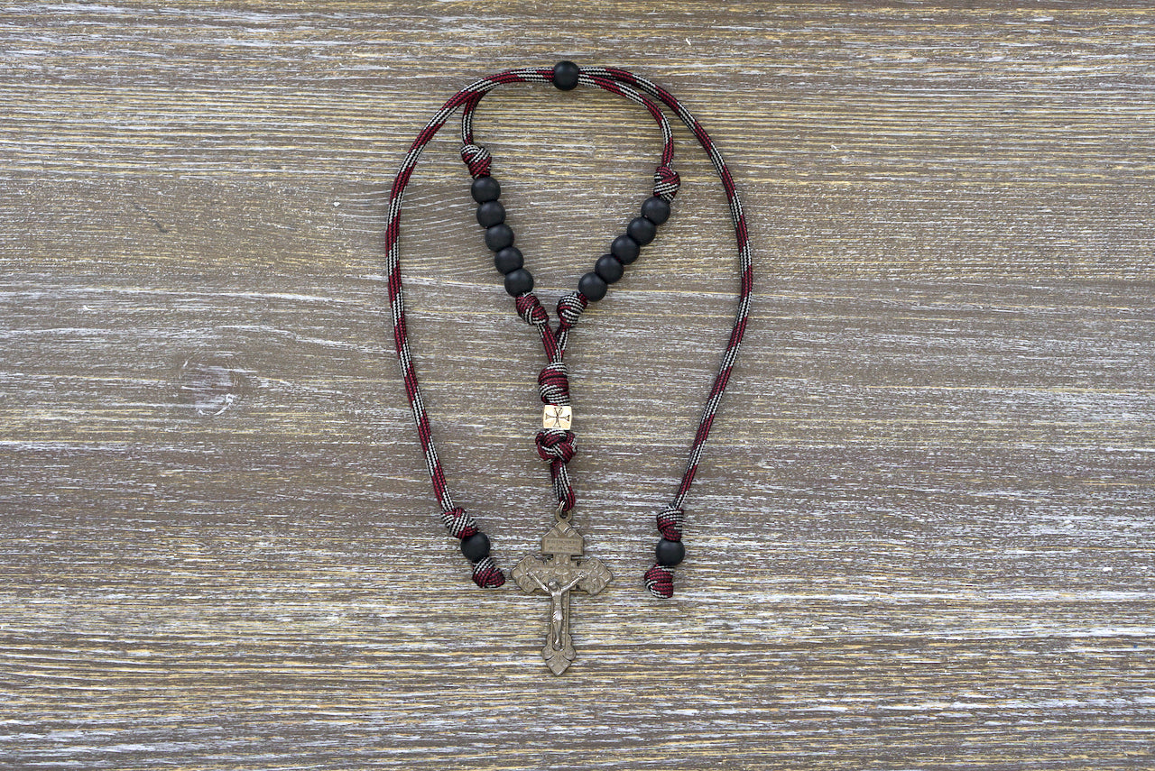 Crusader Rearview Mirror Paracord Rosary - Handmade Catholic prayer accessory with metal Crusader bead, acrylic beads, and a 2-inch gunmetal Pardon Crucifix. Perfect for on-the-go devotion and easy attachment to car rearview mirrors.