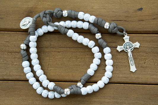 The Faithful Fortress - Gray, Ivory and Silver - 5 Decade Paracord Rosary, featuring a comfortable 19-inch length with durable 10mm beads, Miraculous Medal devotional medal, St. Benedict Crucifix, and handmade by our small Catholic family for your daily spiritual battles.