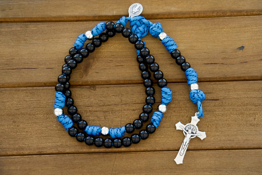 The Royal Warrior | Blue, Black & Silver | 5 Decade Paracord Rosary - Unbreakable Catholic rosary designed for kids with royal blue paracord, black acrylic Hail Mary beads, silver Our Father beads, smaller Miraculous Medal, and 2" St. Benedict Crucifix.
