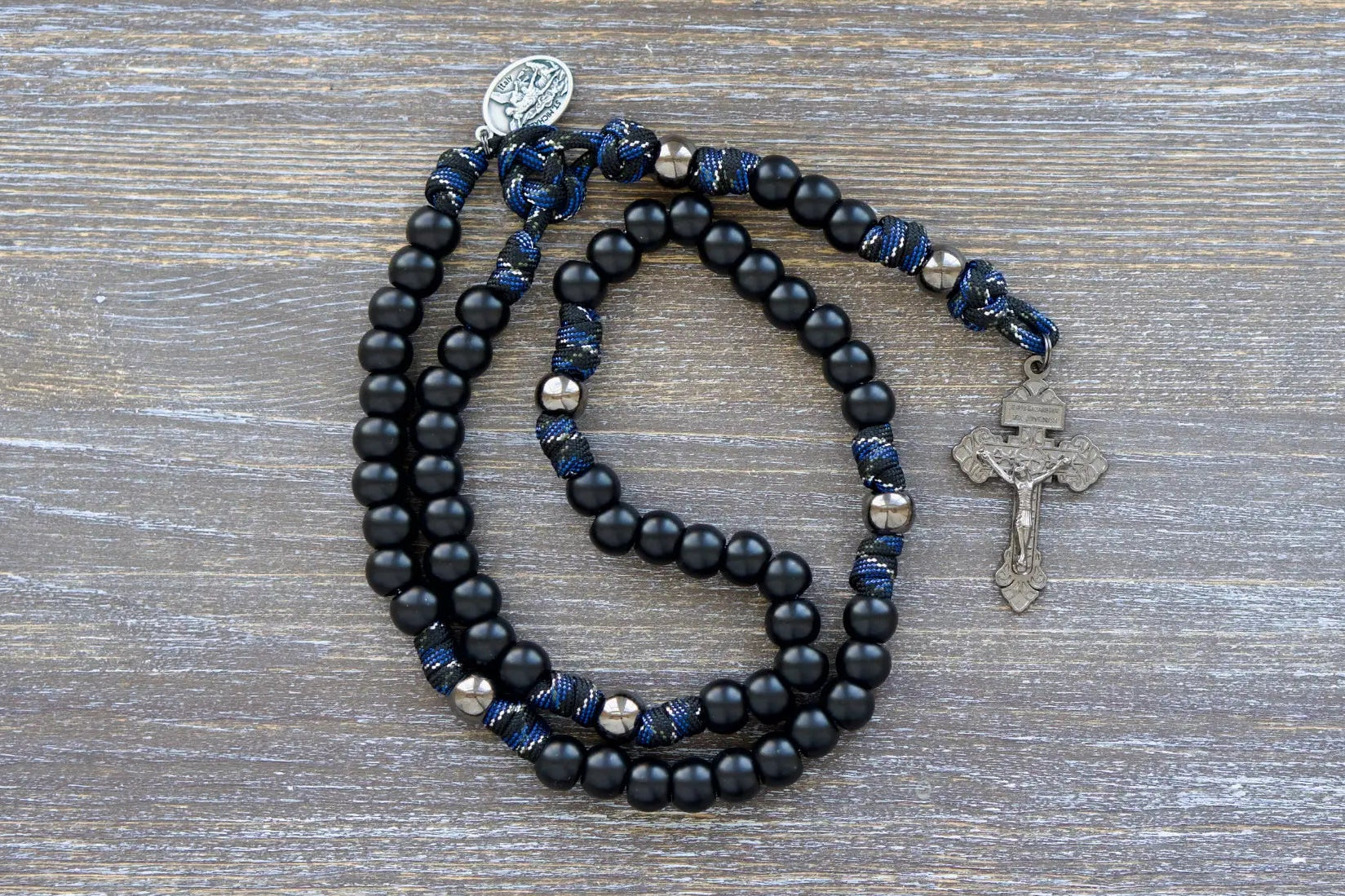 Thin Blue Line - 5 Decade Paracord Rosary: camo paracord, matte black Hail Mary beads, gunmetal Our Father beads, and a devotional medal with St. Michael and Guardian Angel medal.