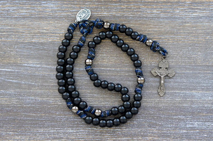 Thin Blue Line - 5 Decade Paracord Rosary: camo paracord, matte black Hail Mary beads, gunmetal Our Father beads, and a devotional medal with St. Michael and Guardian Angel medal.