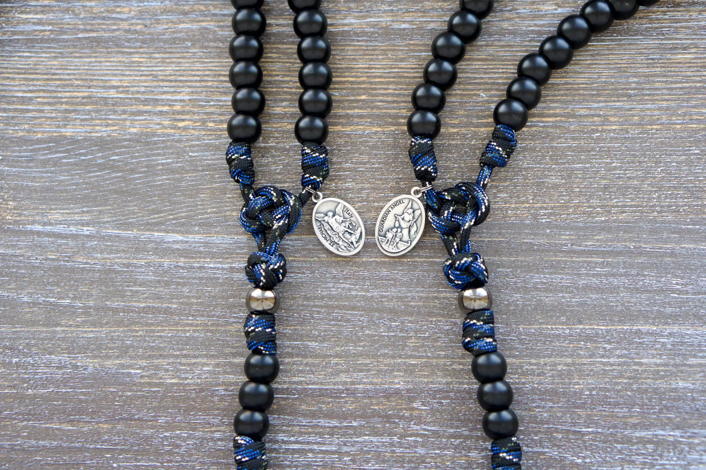 Thin Blue Line - 5 Decade Paracord Rosary: camo paracord rope rosary with matte black Hail Mary beads, gunmetal Our Father beads, and St. Michael/Guardian Angel devotional medal.