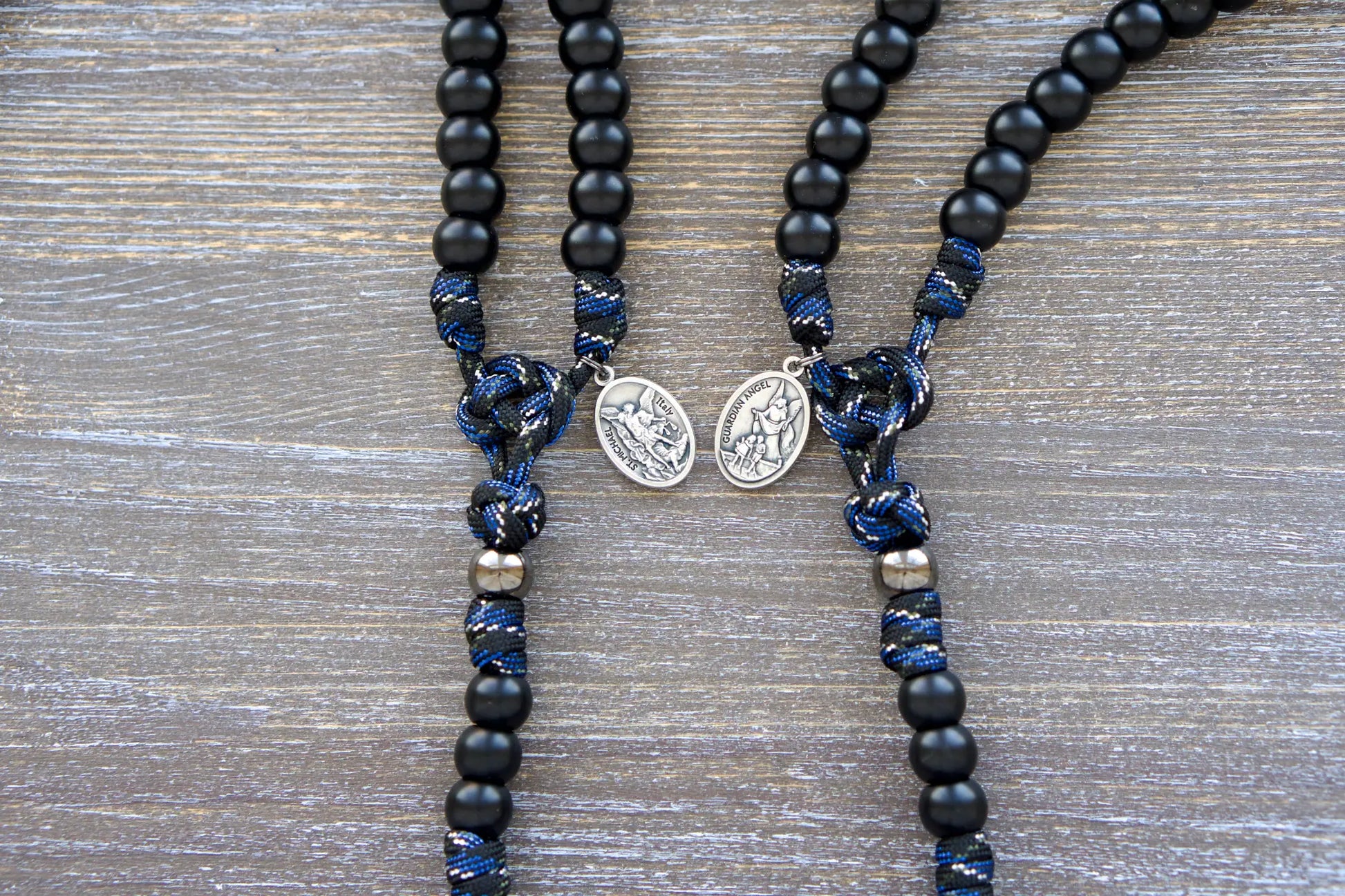 Thin Blue Line - 5 Decade Paracord Rosary: camo paracord rope rosary with matte black Hail Mary beads, gunmetal Our Father beads, and St. Michael/Guardian Angel devotional medal.
