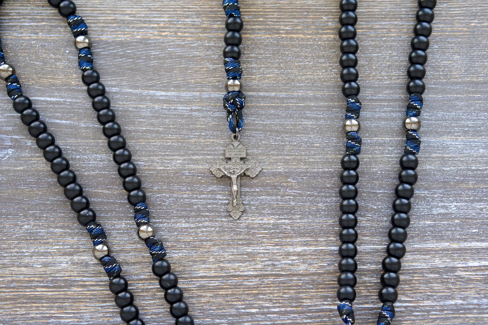 Thin Blue Line - 5 Decade Paracord Rosary:  Matte black and gunmetal beads on camo paracord rope with St. Michael/Guardian Angel medal and gunmetal crucifix.