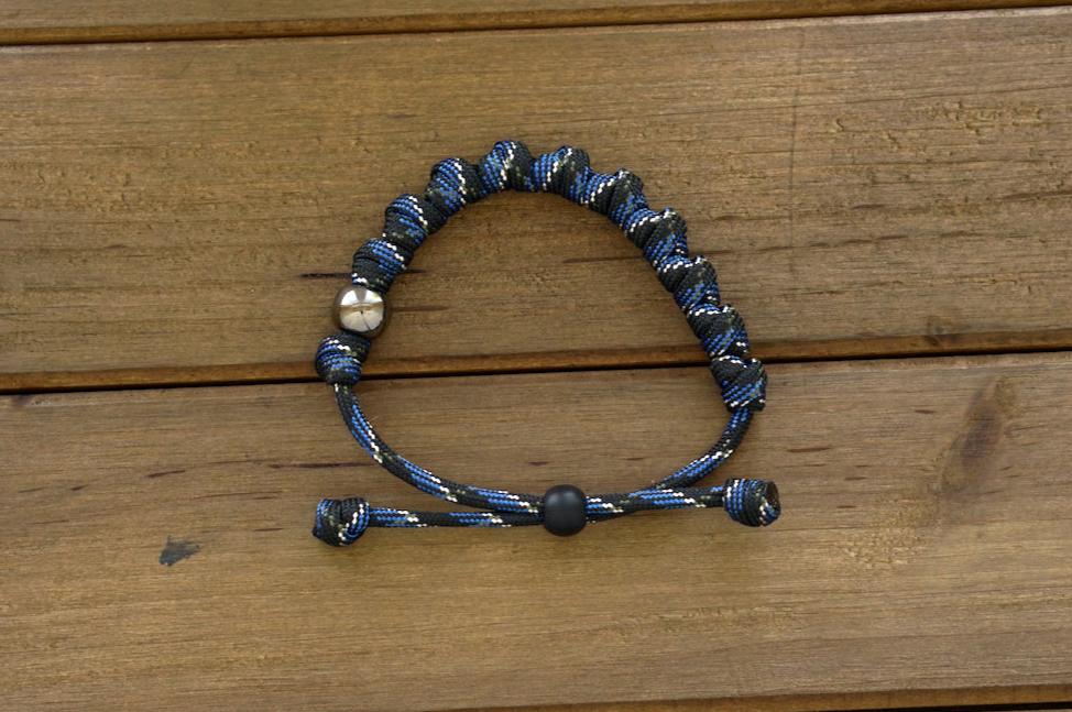 Thin Blue Line - Rosary Bracelet: A modern, stylish, and powerful tool for prayer featuring blue/black/silver paracord, gunmetal Our Father beads, and ten knotted Hail Mary's.