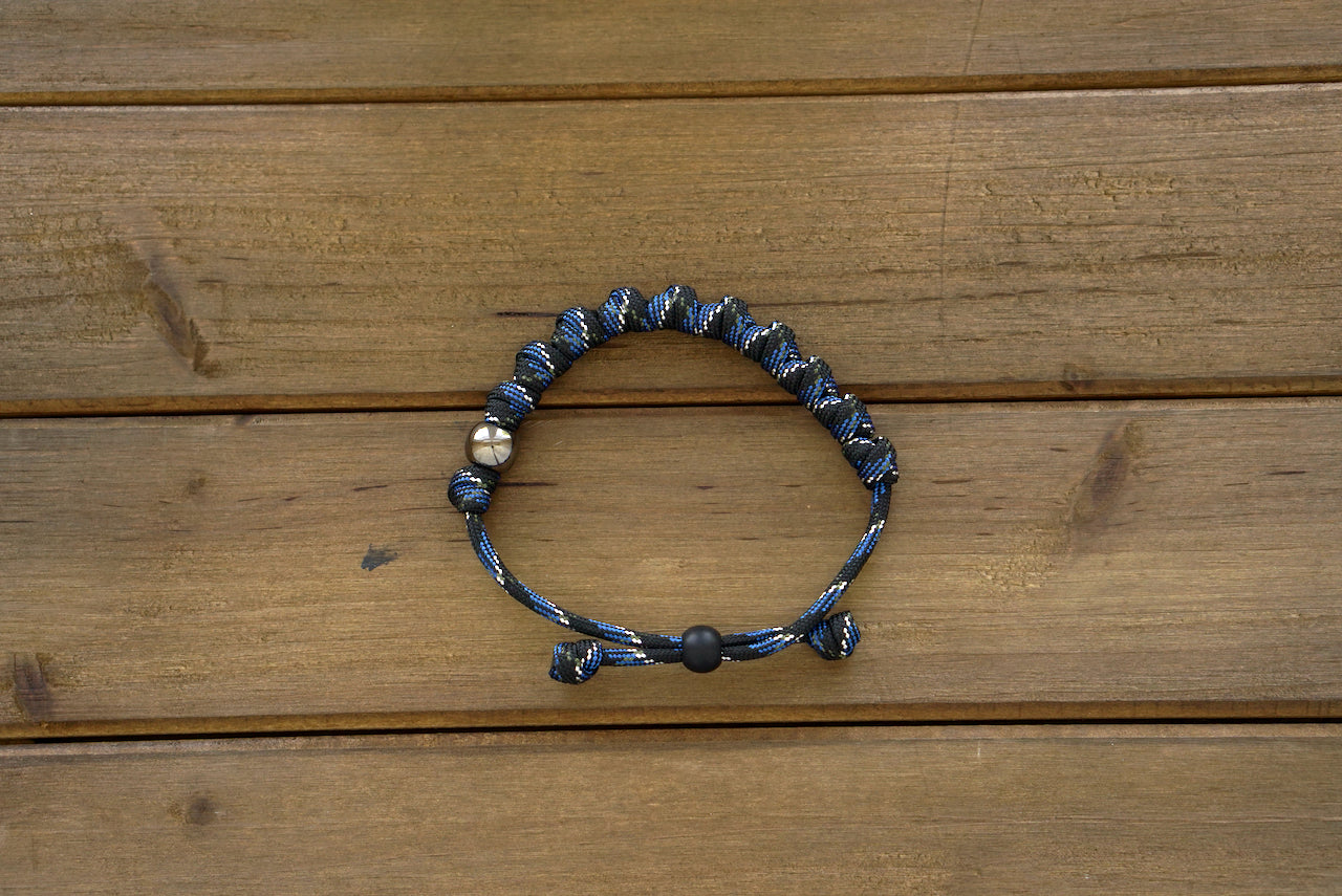 Thin Blue Line - Rosary Bracelet: Stunning blue/black/silver paracord bracelet featuring ten knotted Hail Mary beads and gunmetal Our Father beads for modern Catholic prayer.