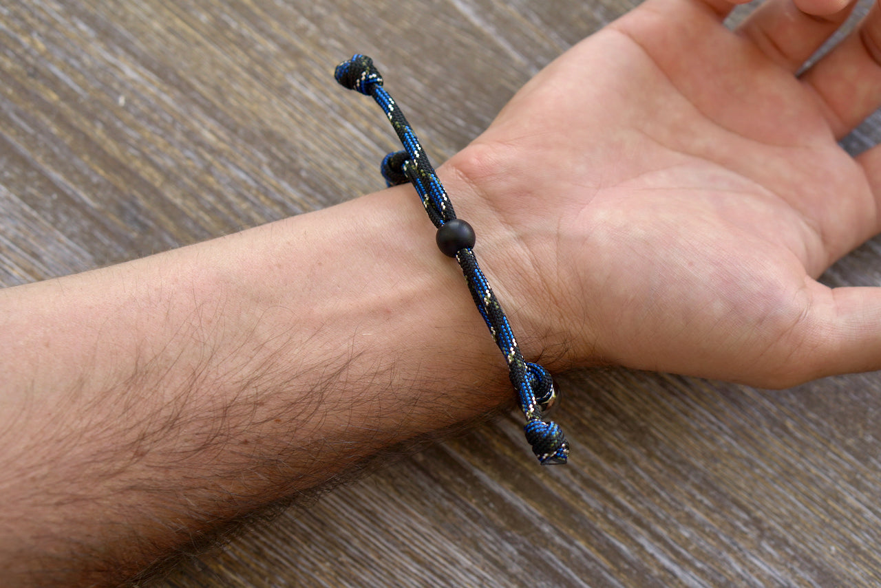 Thin Blue Line - Rosary Bracelet for Adults: Modern, Stylish Prayer Tool Made from Blue/Black/Silver Paracord with Gunmetal Our Father Beads and Knotted Hail Mary's.