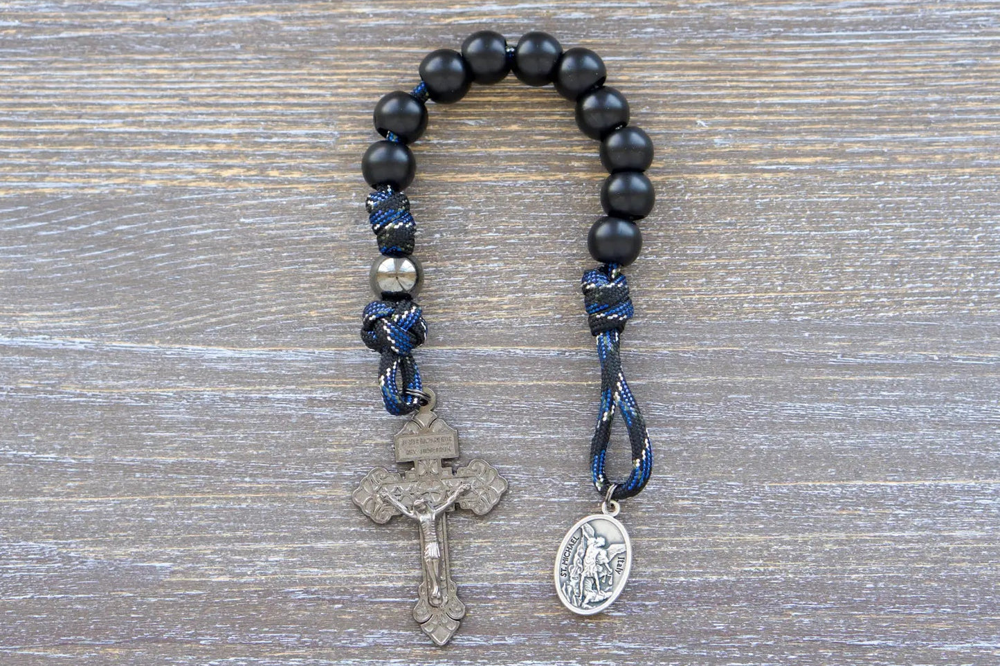 Thin Blue Line Pocket Paracord Rosary: gunmetal and matte black beads with camo rope design, featuring St. Michael medal and crucifix