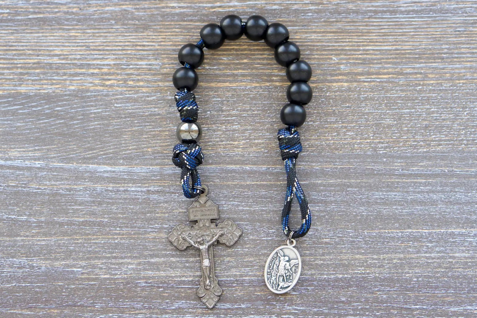 Thin Blue Line Pocket Paracord Rosary: gunmetal and matte black beads with camo rope design, featuring St. Michael medal and crucifix
